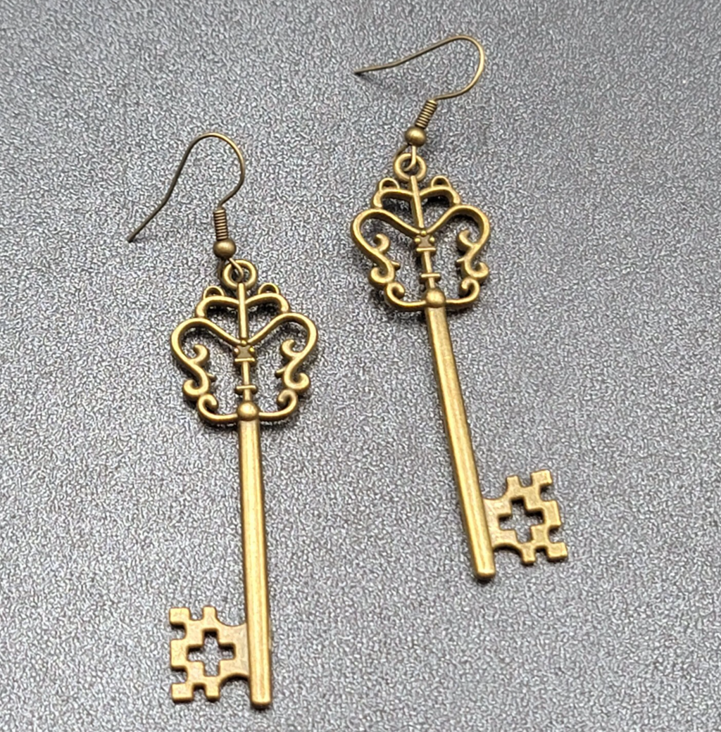 Pierced Earrings Bronze tone Long Antique Skeleton Key Dangle 2.25"