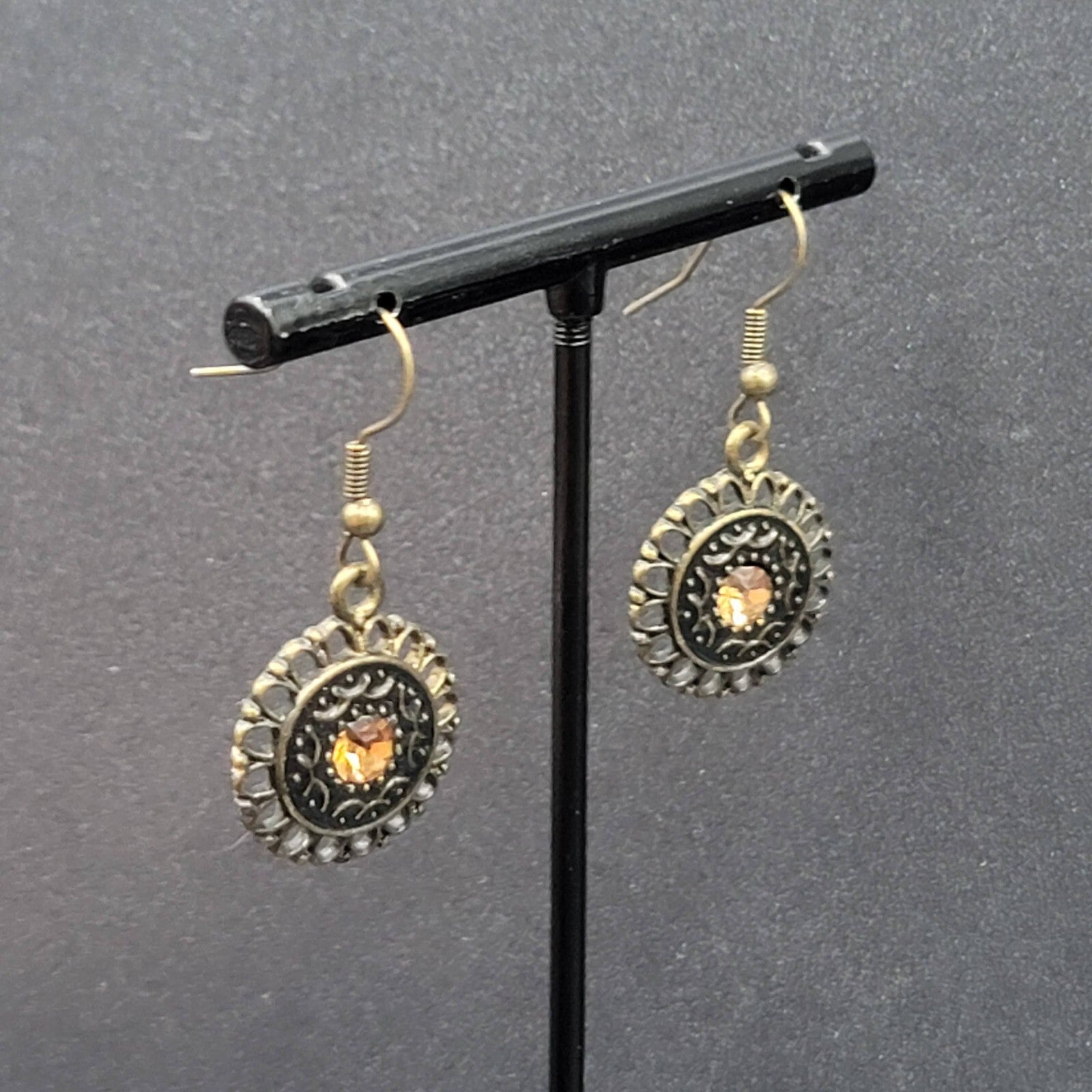 Pierced Earrings Bronze tone Orange Rhinestone Round Filigree 7/8"