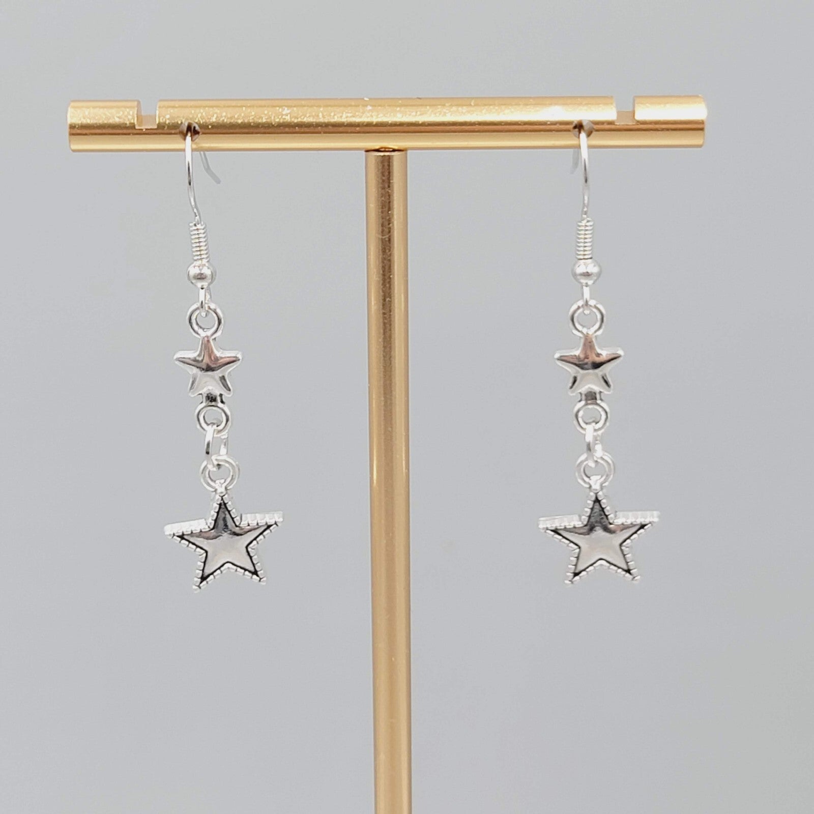 Stars Pierced Earrings Silver tone Embossed Dangle New 1 1/8"