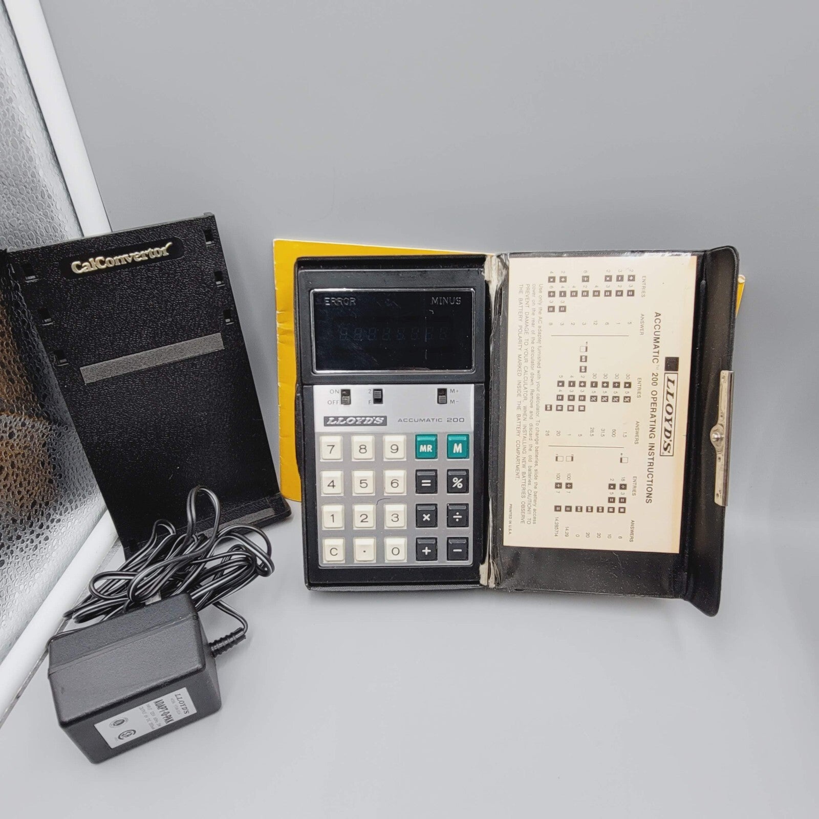 Vintage Lloyds Accumatic 200 Calculator E681 Power cord Manuel Stand