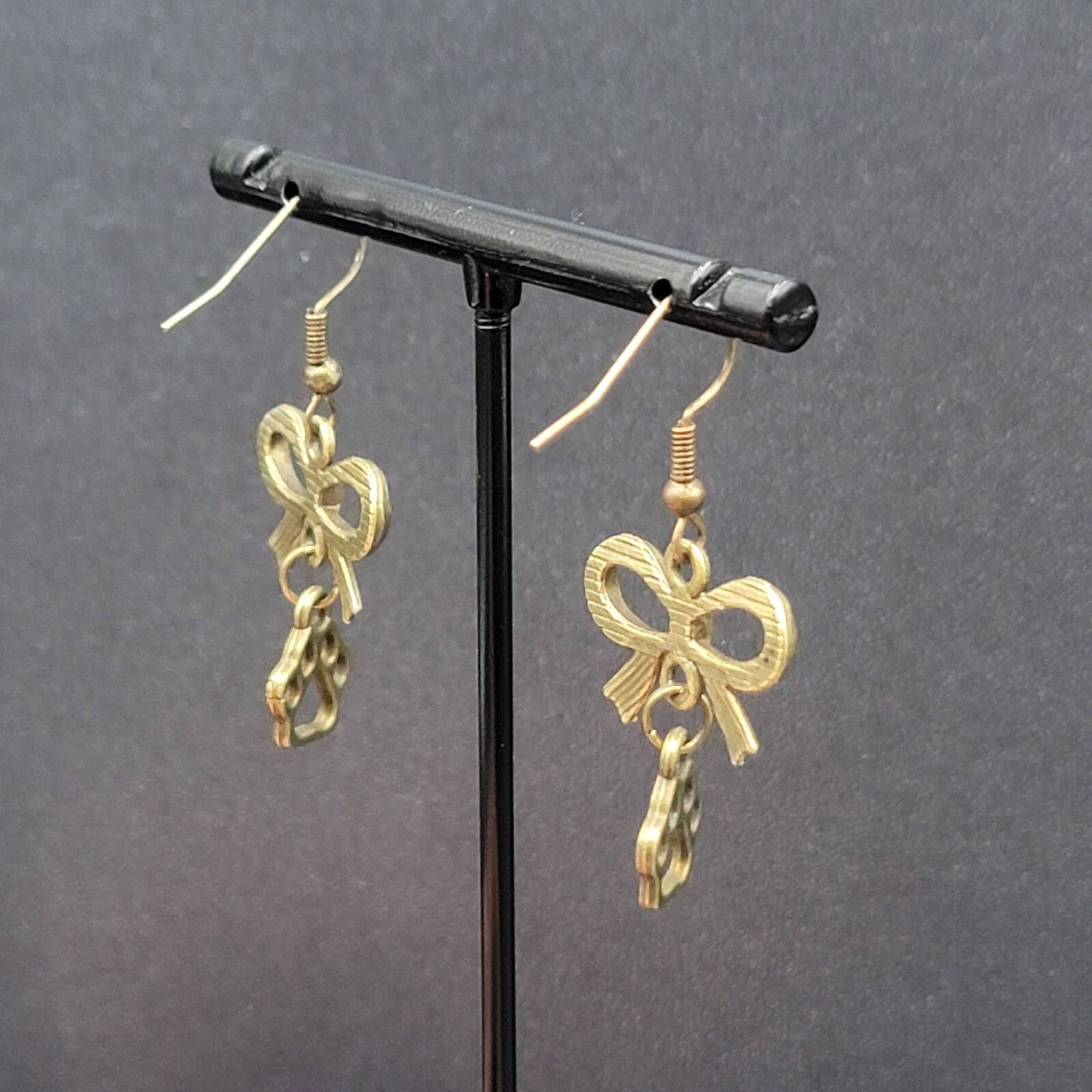 Pierced Bow Dog Paws Earrings Bronze tone Dangle 7/8"