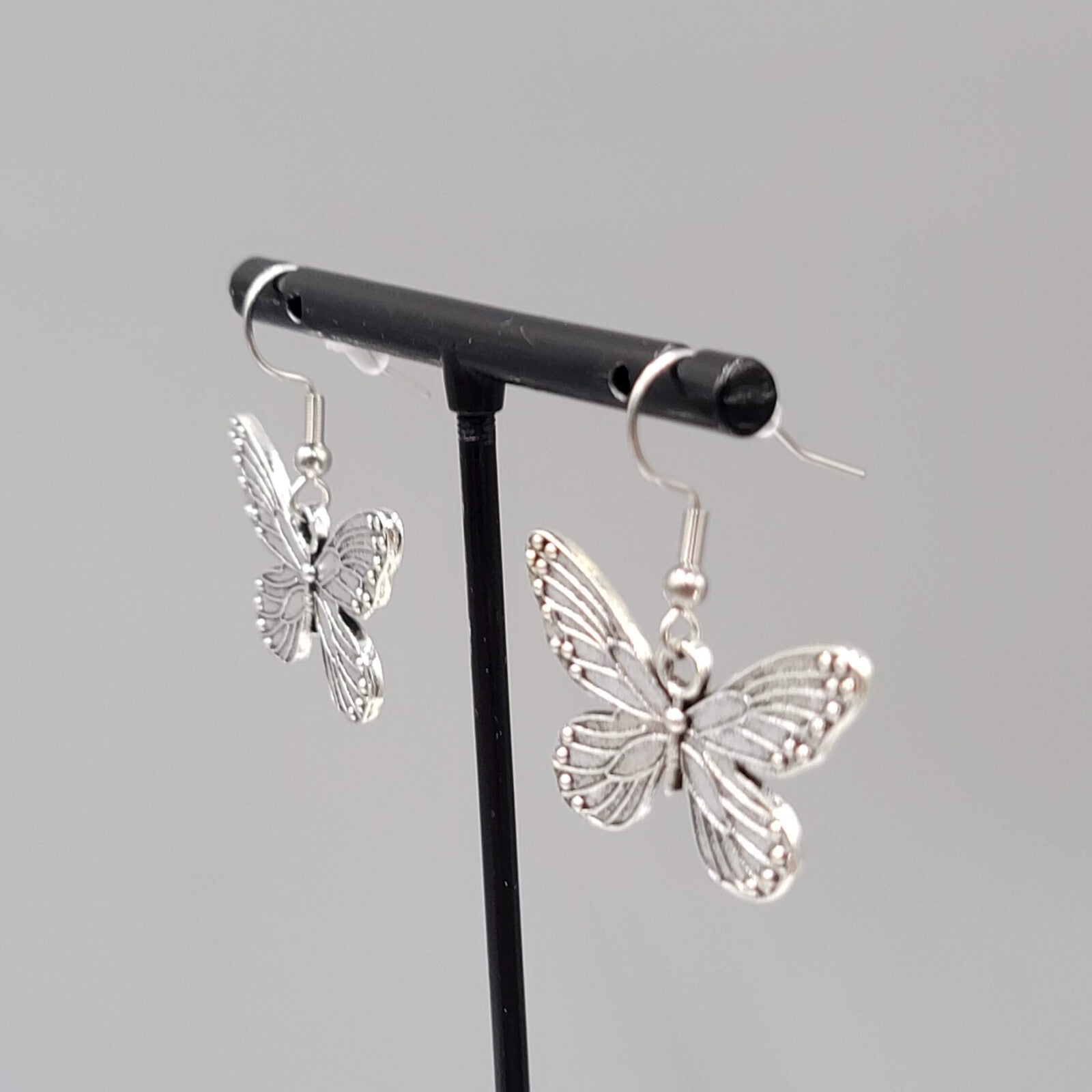 Butterfly Pierced Earrings Silver tone Embossed Dangle 3/4"