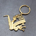 Vintage AJC Keychain Fob Music Sax Guitar Gold tone Piano 3"