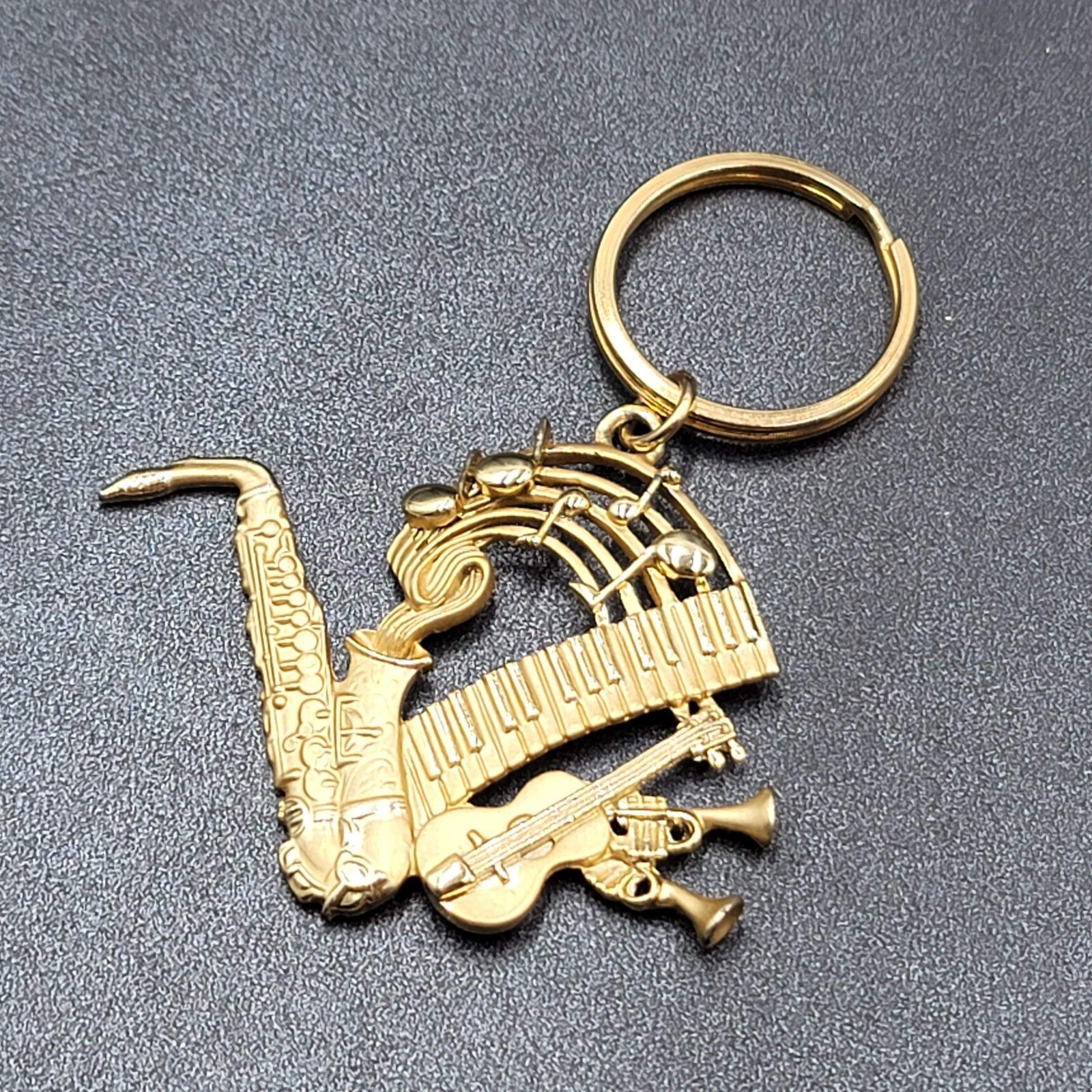 Vintage AJC Keychain Fob Music Sax Guitar Gold tone Piano 3"