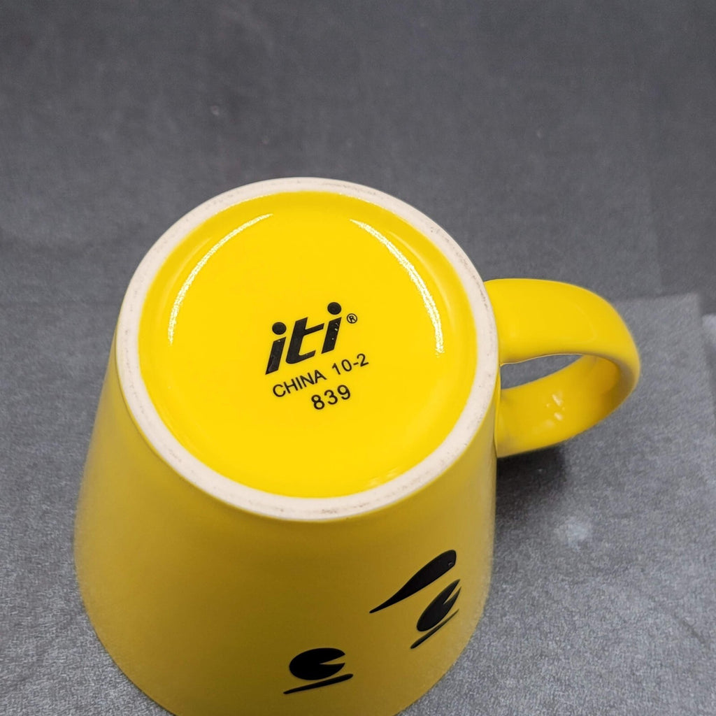 Torpedo Coffee Mug Cup Yellow Winky Face iti