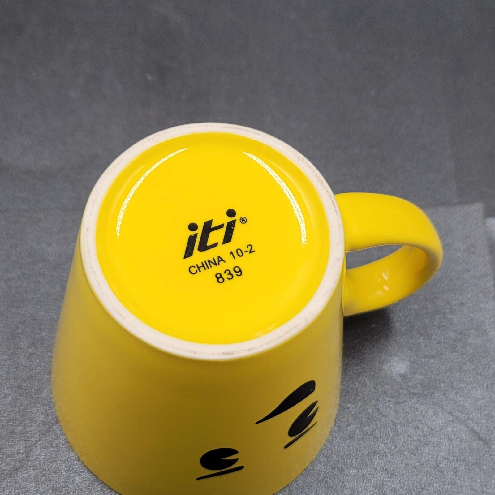 Torpedo Coffee Mug Cup Yellow Winky Face iti