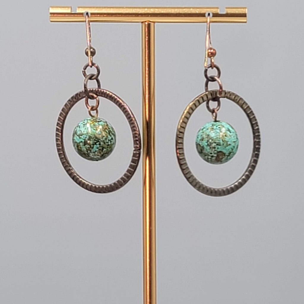Bronze tone Dangle Pierced Earrings Green Bead Center Dangle 1.5"