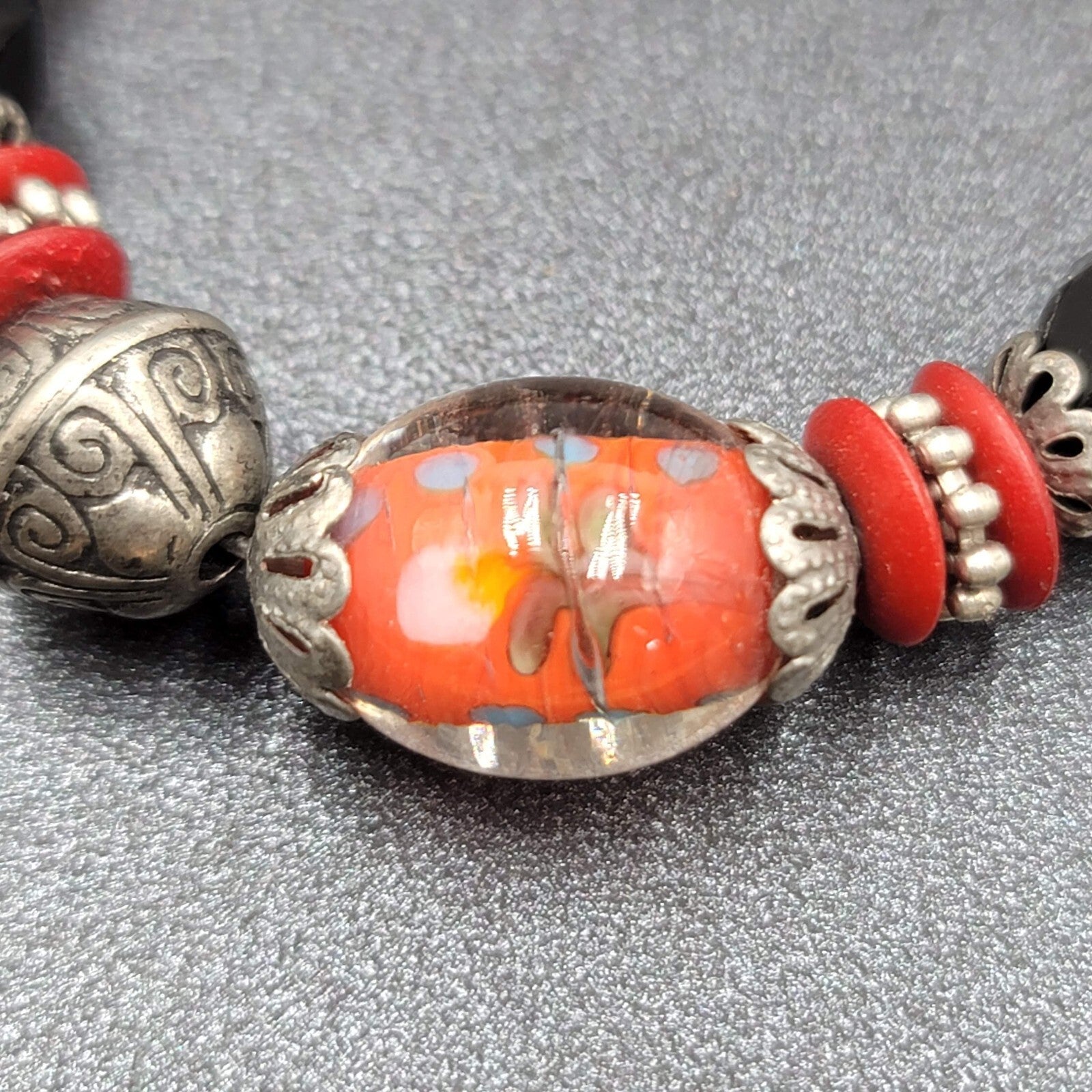 Beaded Bracelet Art Glass Red Black Silver tone Embossed Beads Elastic 6"
