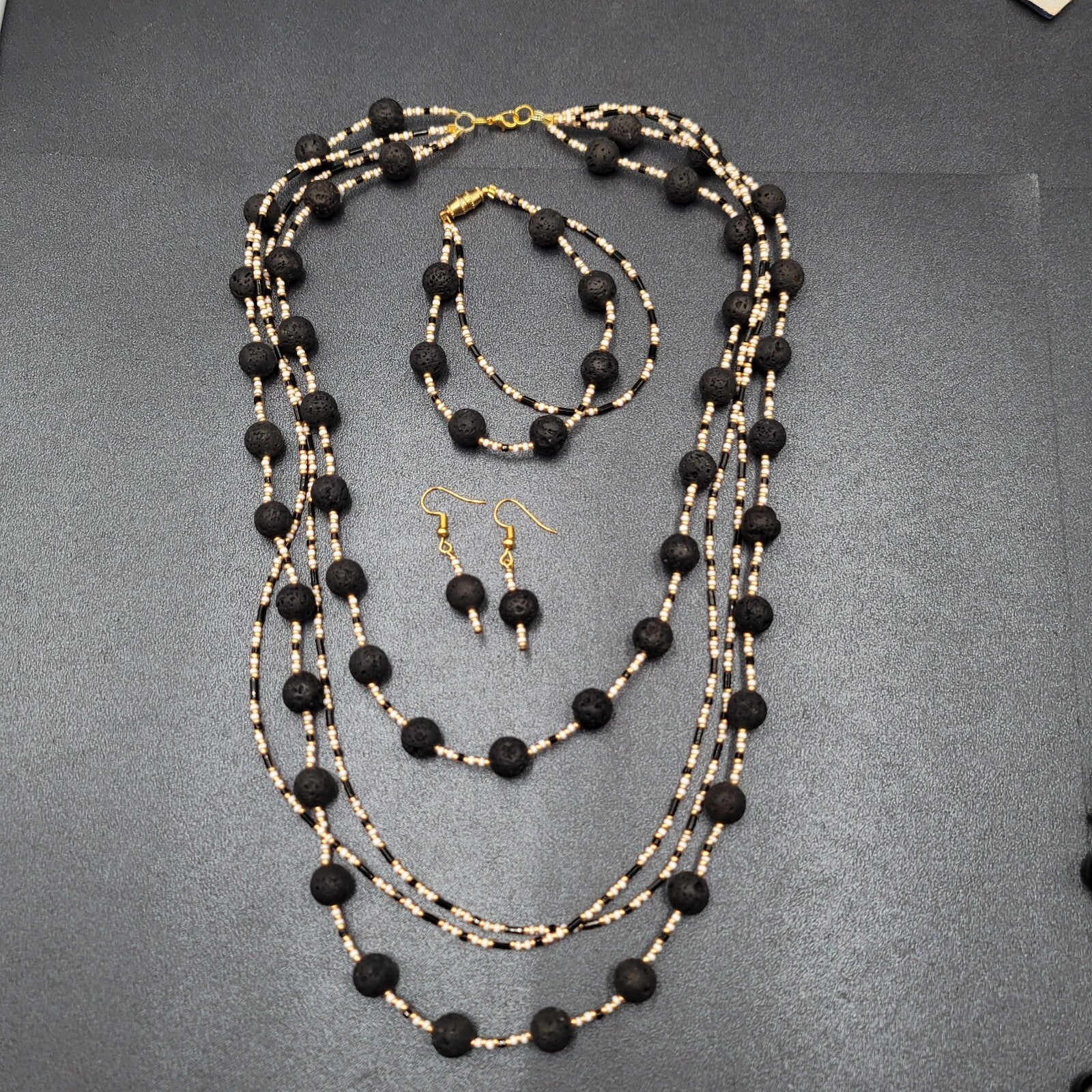 Beaded Necklace Bracelet Earrings Set Gold tone White Black Lava Bead Set