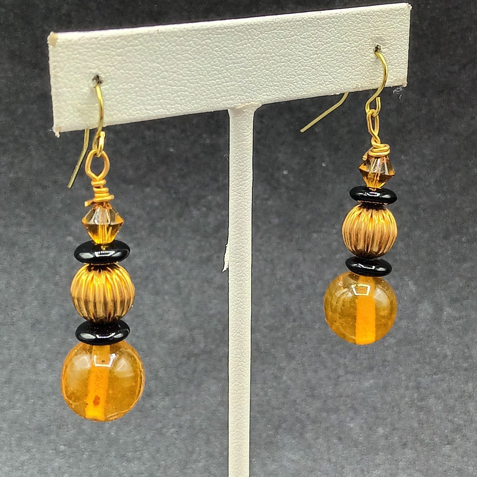 Pierced Earrings Gold tone Orange Black Beaded Statement Dangle 1.5"