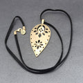The Sak Necklace Gold tone Pendant Black Faux Leather Cord 28"
