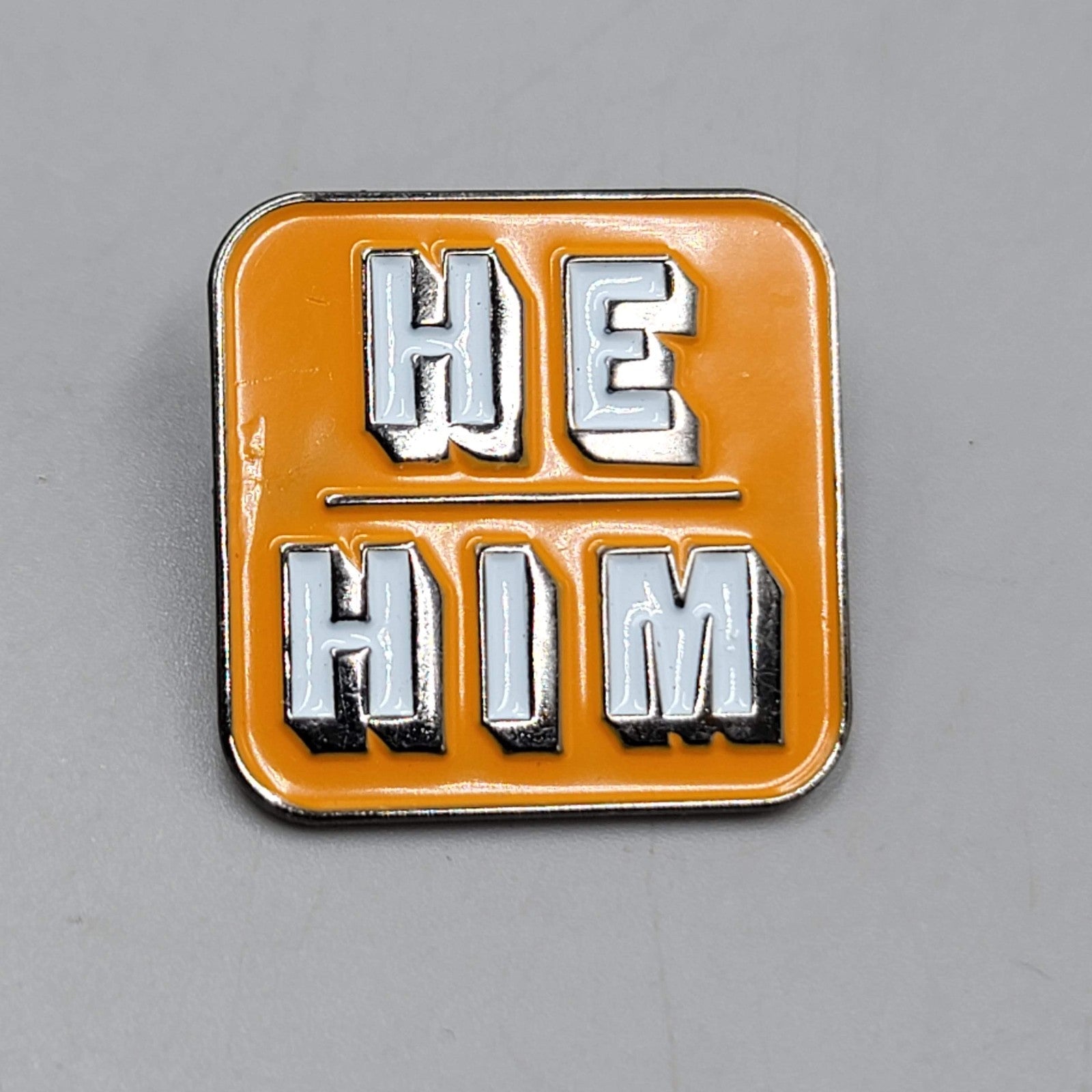 He Him Enamel Lapel Hat Pin Orange White Square Pronouns  1"
