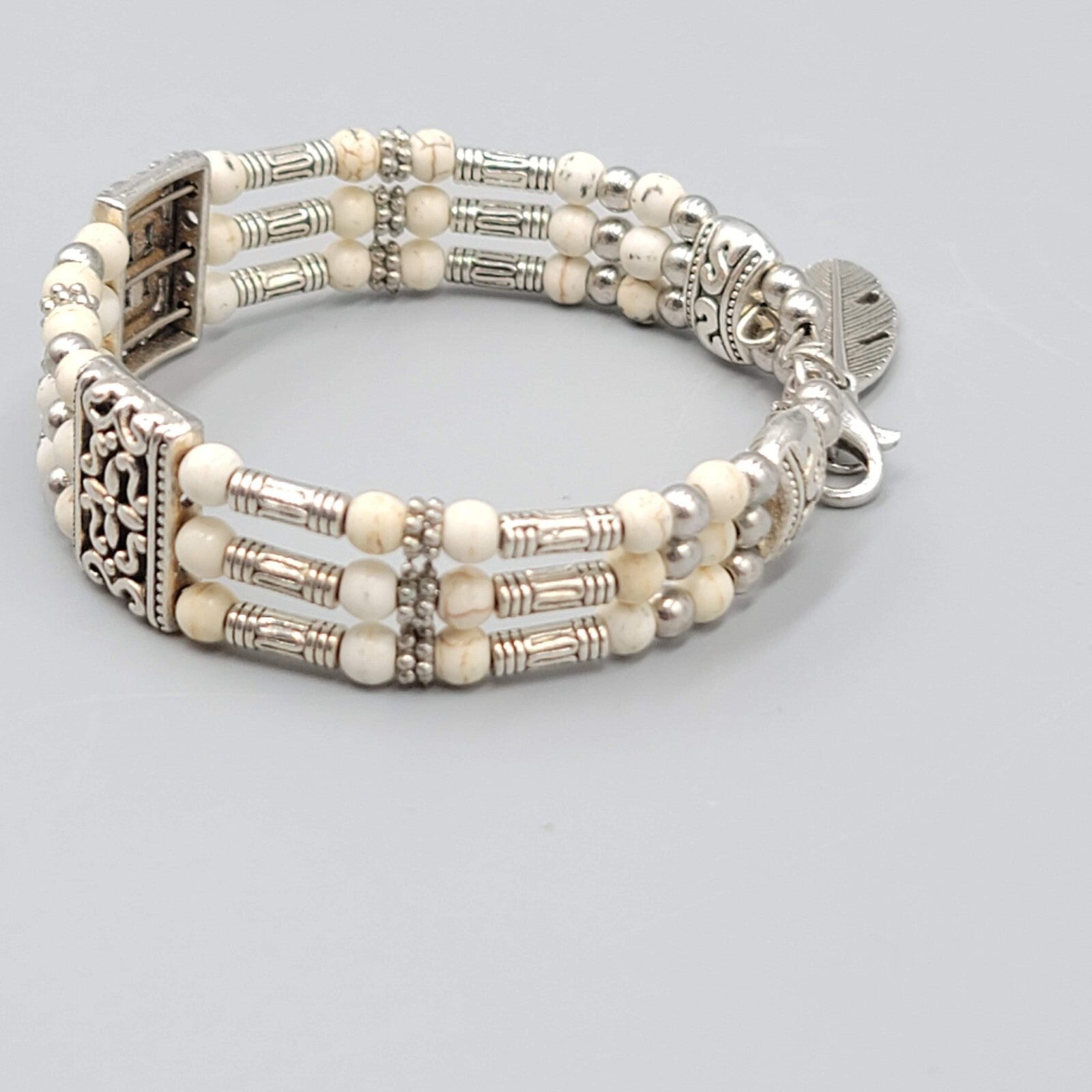 White Stone Bead Bracelet Triple Strand Silver tone Feather Charm 6.75"