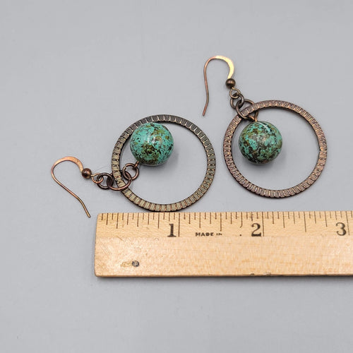 Bronze tone Dangle Pierced Earrings Green Bead Center Dangle 1.5"