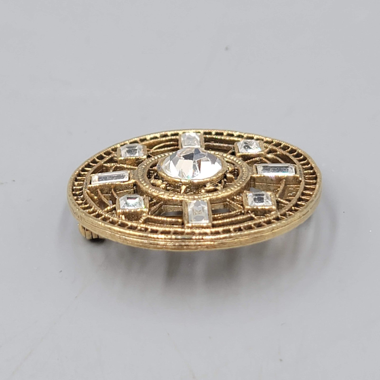 Vintage 1928 Round Open Work Brooch Gold tone Rhinestone 1 3/8 in