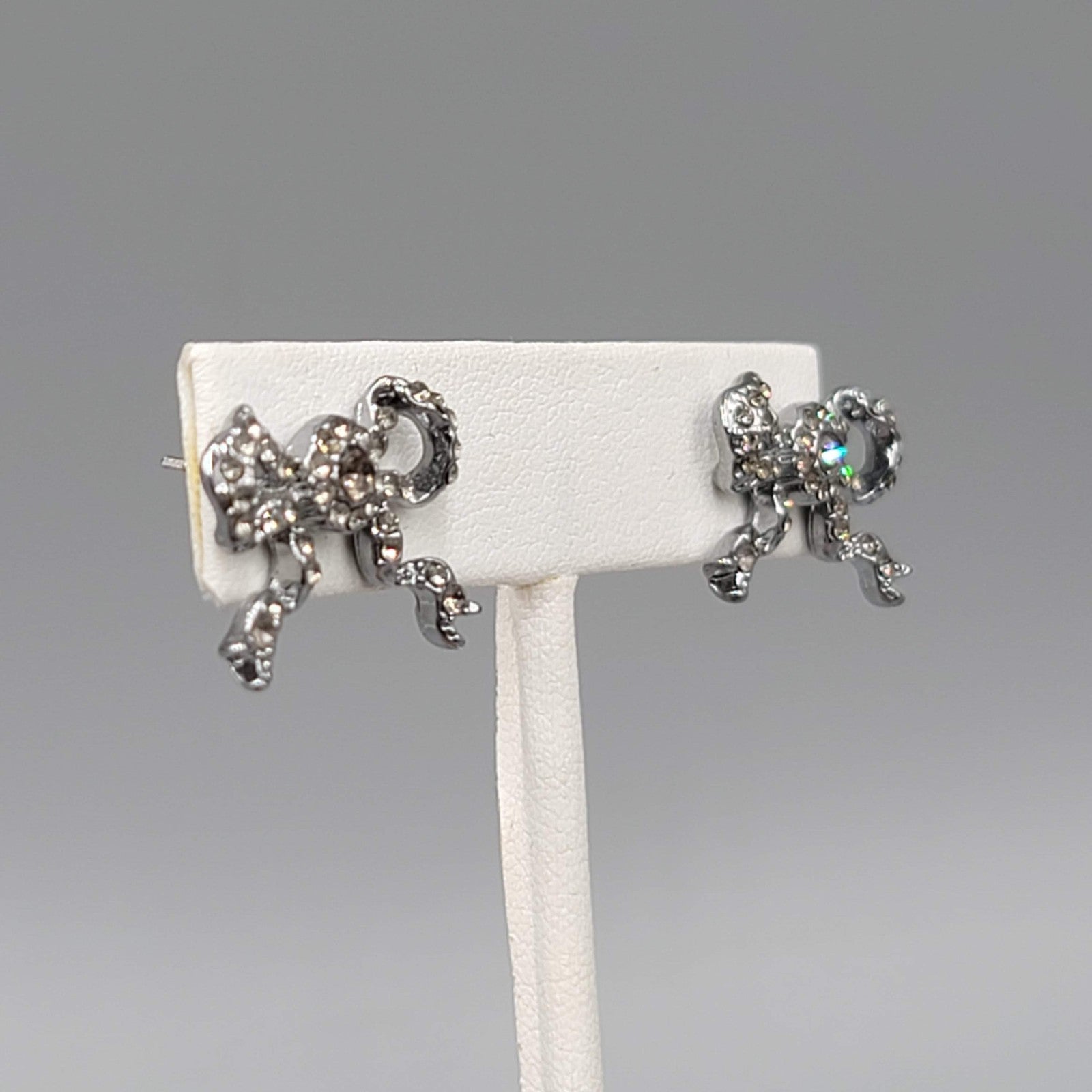 Rhinestone Bow Pierced Earrings Gunmetal Gray Drop 5/8 in