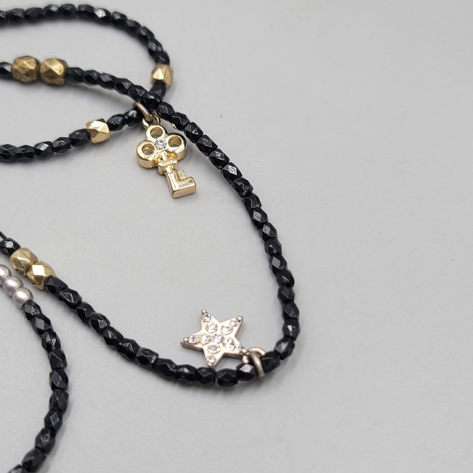 AEO American Eagle Outfitters Necklace Black Seed Bead Gold tone Charms Long 36"