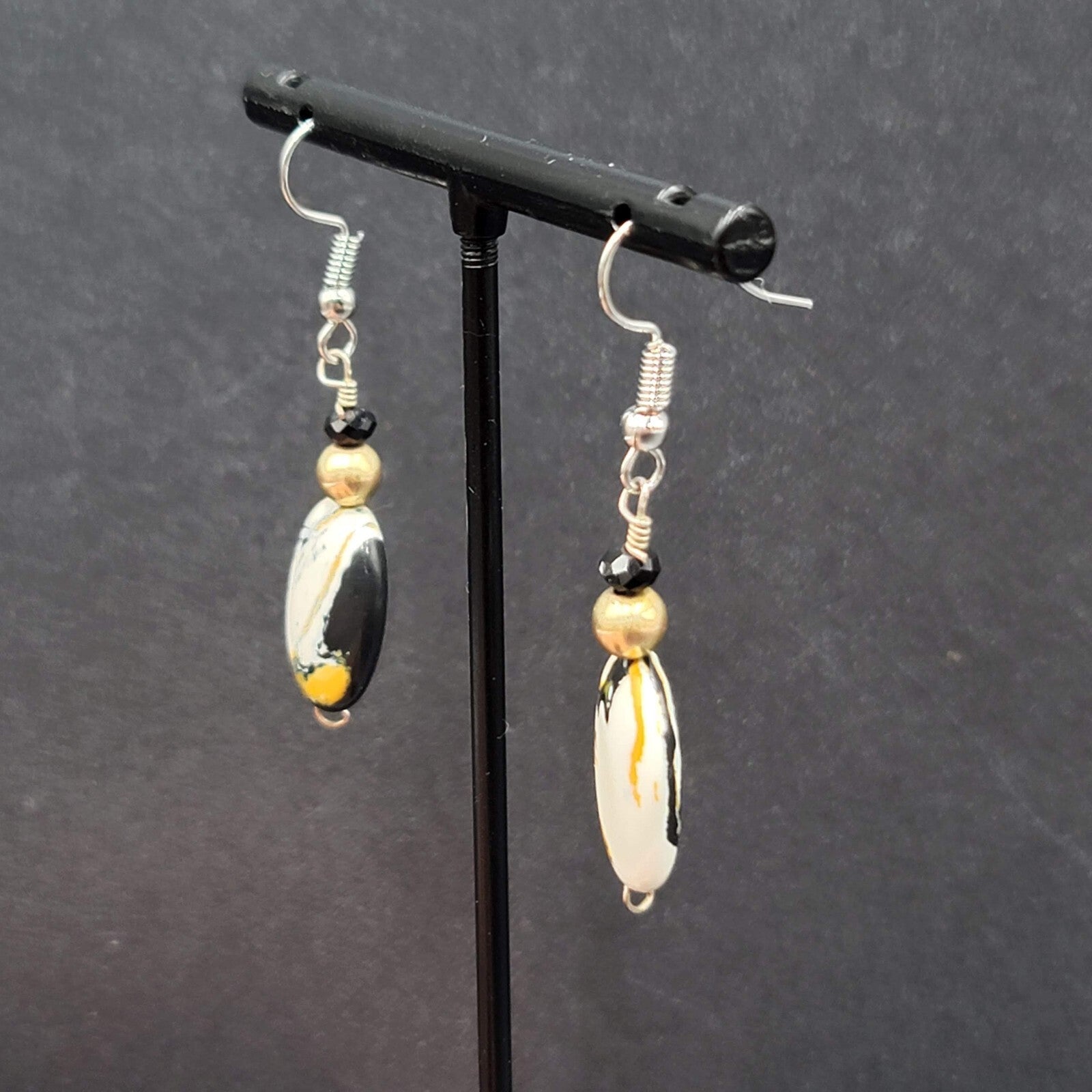Pierced Earrings Silver tone Black White Yellow Art Glass Oval Bead Dangle 1.25"
