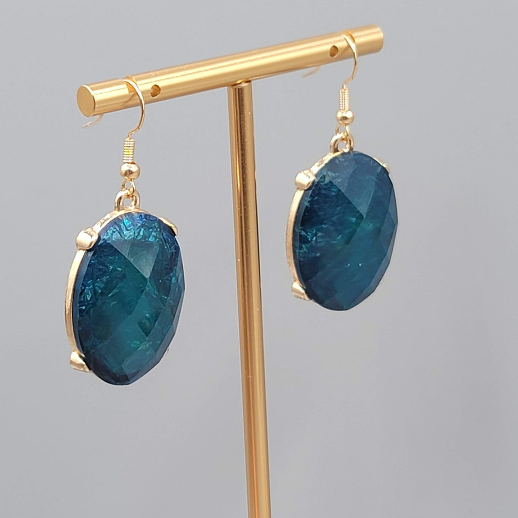 Blue Oval Faceted Swirl Resin Pierced Earrings Gold tone Dangle 1.25 in