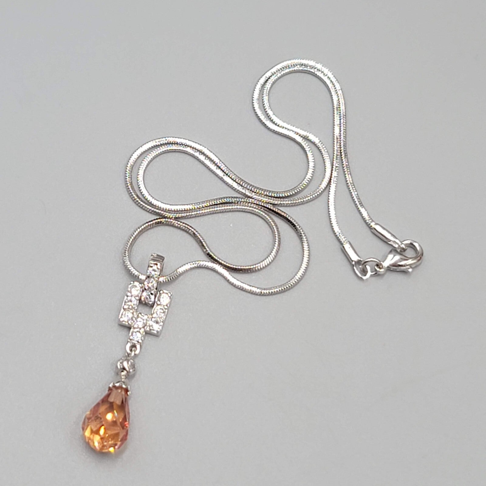 Orange Crystal Teardrop Pendant Necklace Silver tone Snake Chain 15"