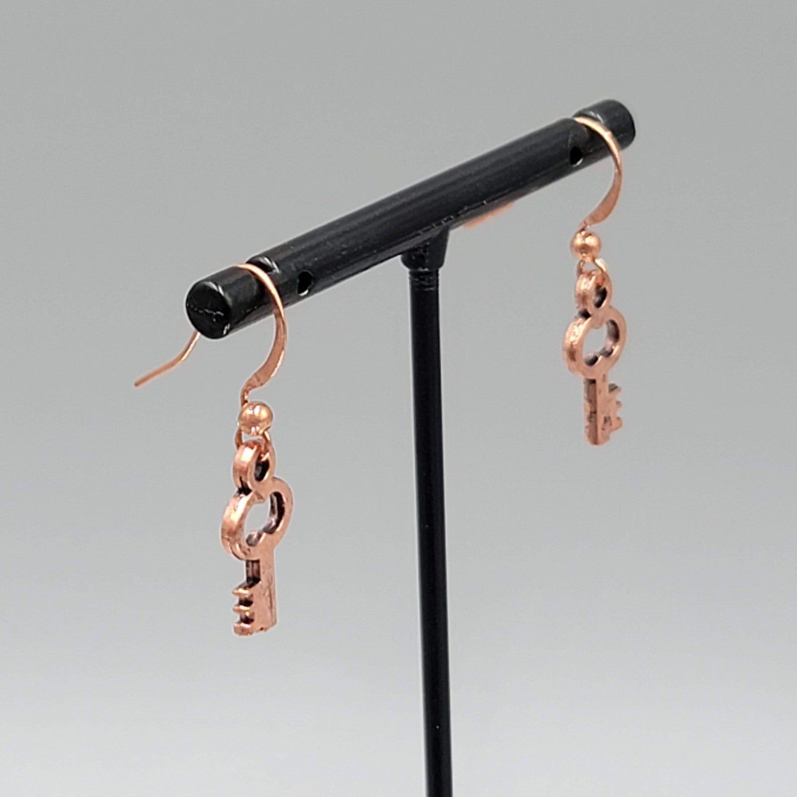 Small Copper tone Skeleton Key Pierced Earrings Dangle 5/8"