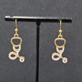 Nurse Pierced Earrings White Enamel Stethoscope Gold tone Dangle 1 1/8"