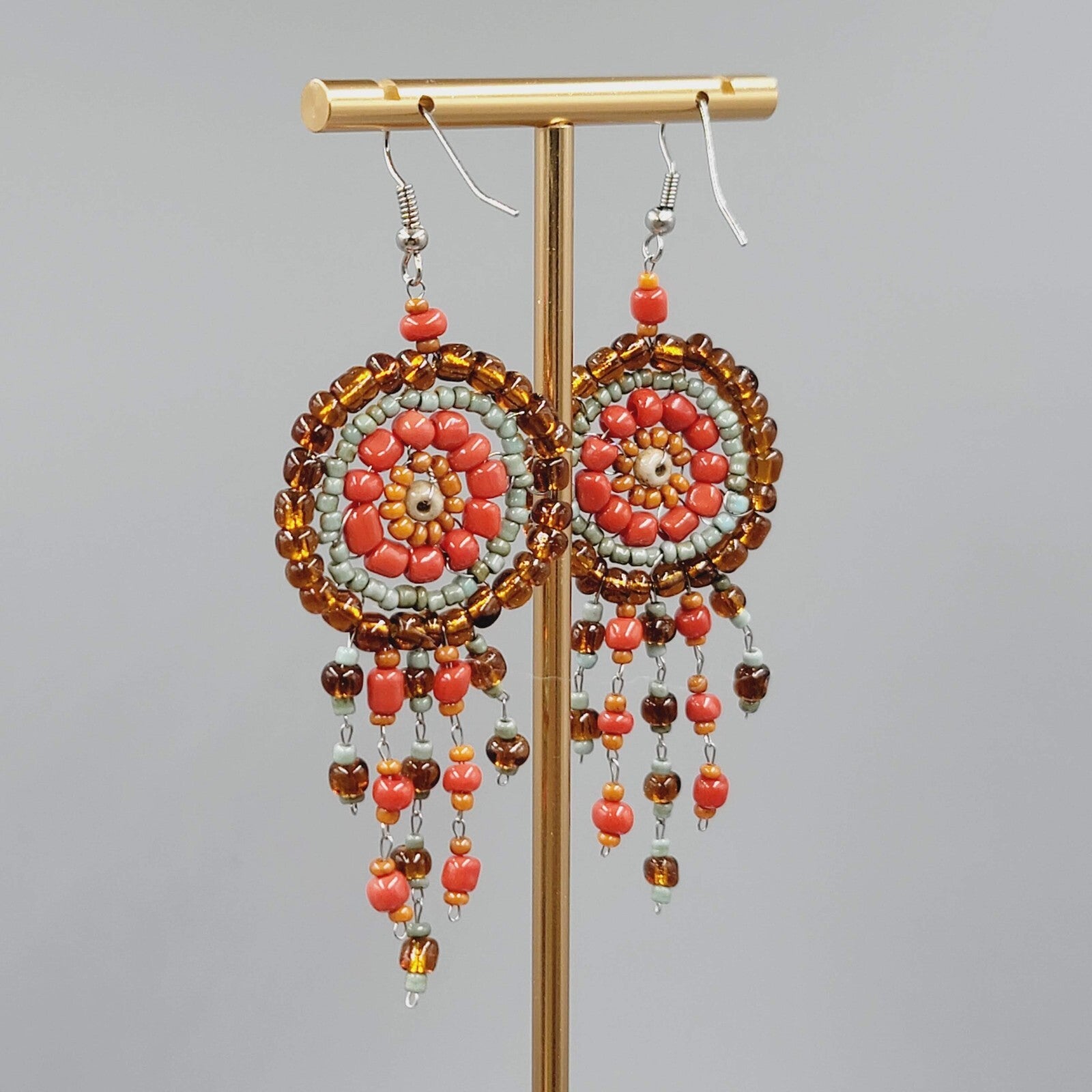 Medallion Bead Pierced Earrings Silver tone Dangle Orange Brown Blue 2.25"