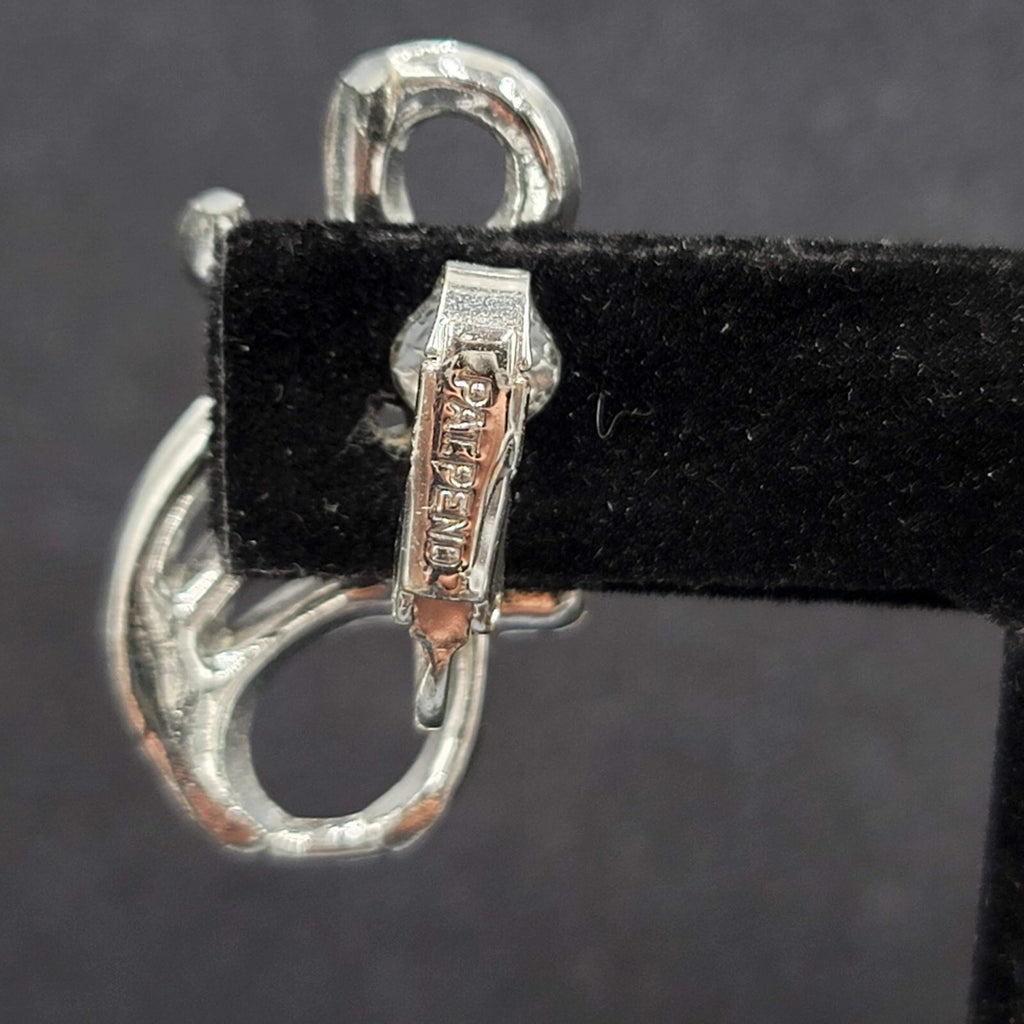 Vintage Clip on Earrings Pat Pend Silver tone Swirl Climber 1.25"