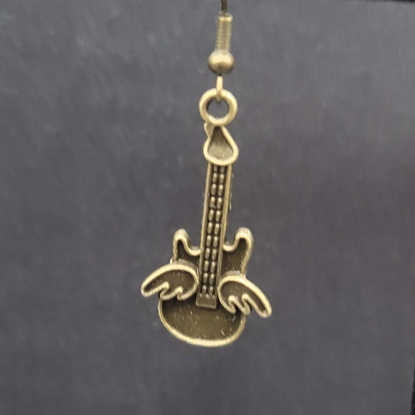 Pierced Earrings Bronze tone Embossed Winged Guitar Dangle 1.25"