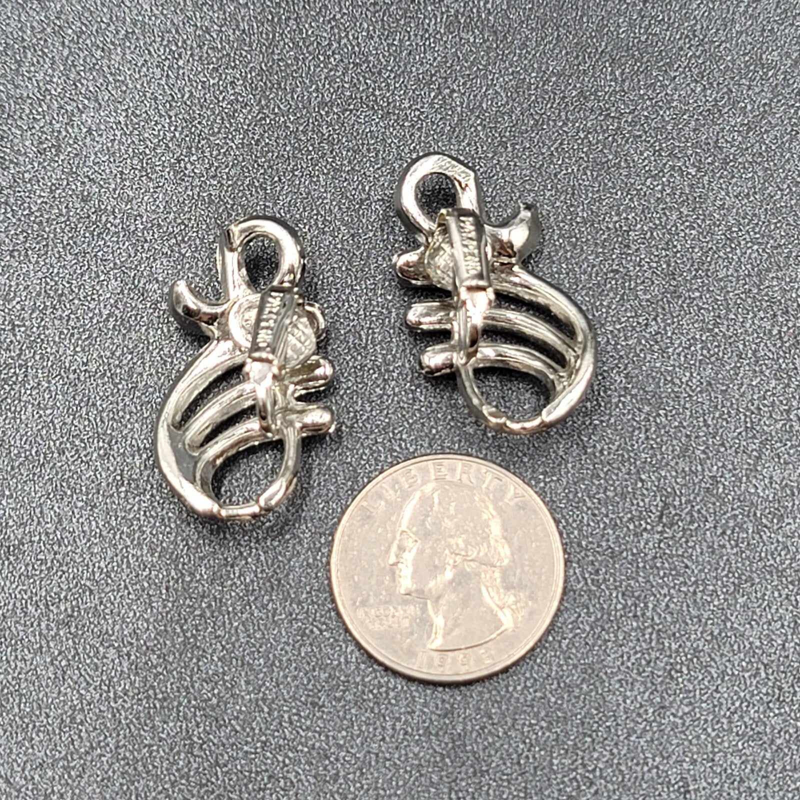 Vintage Clip on Earrings Pat Pend Silver tone Swirl Climber 1.25"
