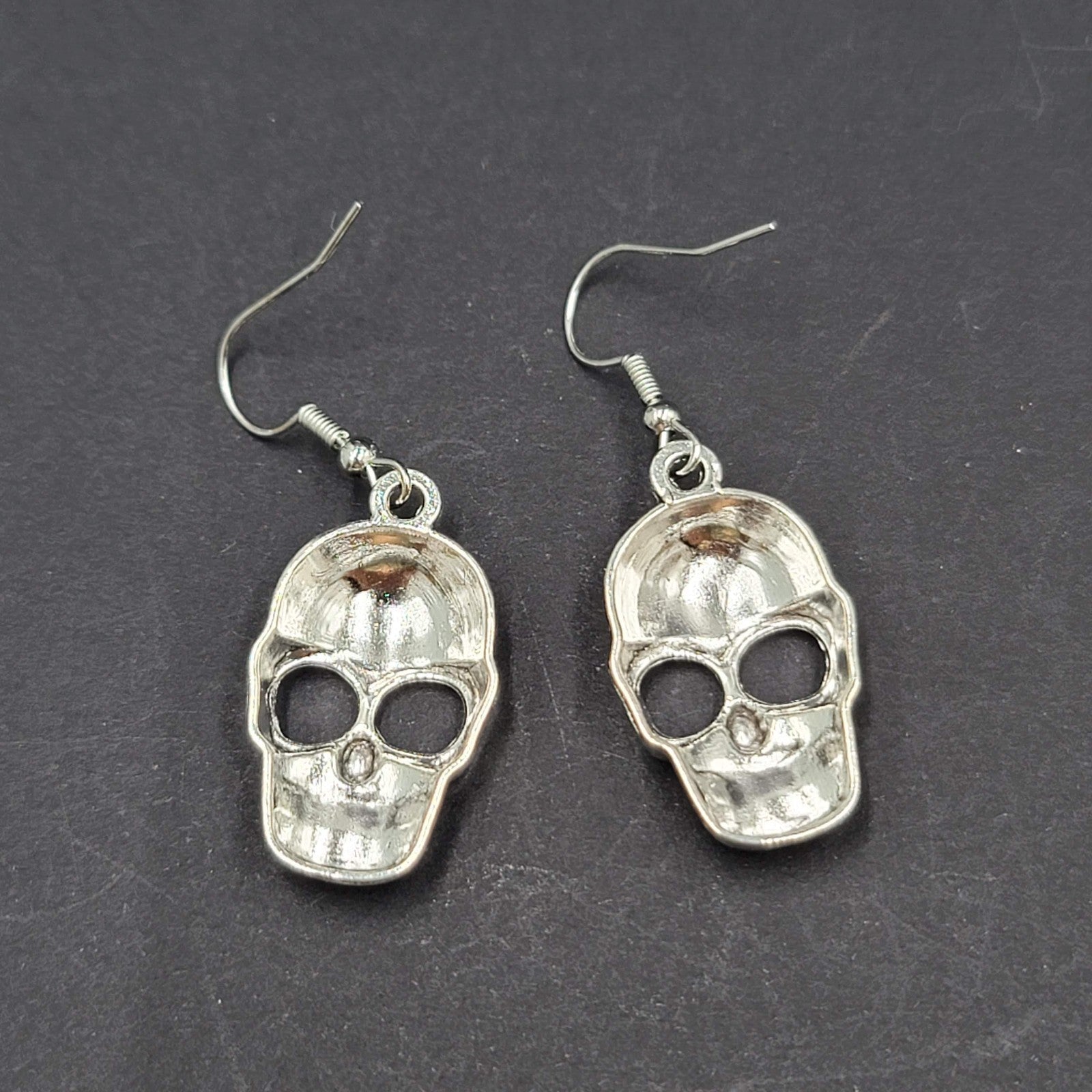 Embossed Skull Silver tone Dangle  Pierced Earrings New Halloween 1 1/8"