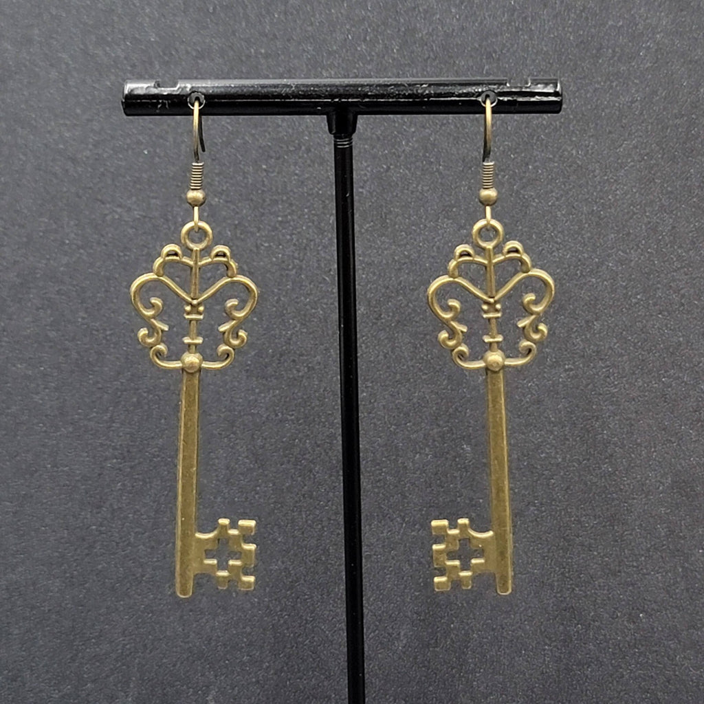 Pierced Earrings Bronze tone Long Antique Skeleton Key Dangle 2.25"