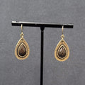 Pierced Earrings Antiqued Gold tone Teardrop Faceted Red Accent 1"