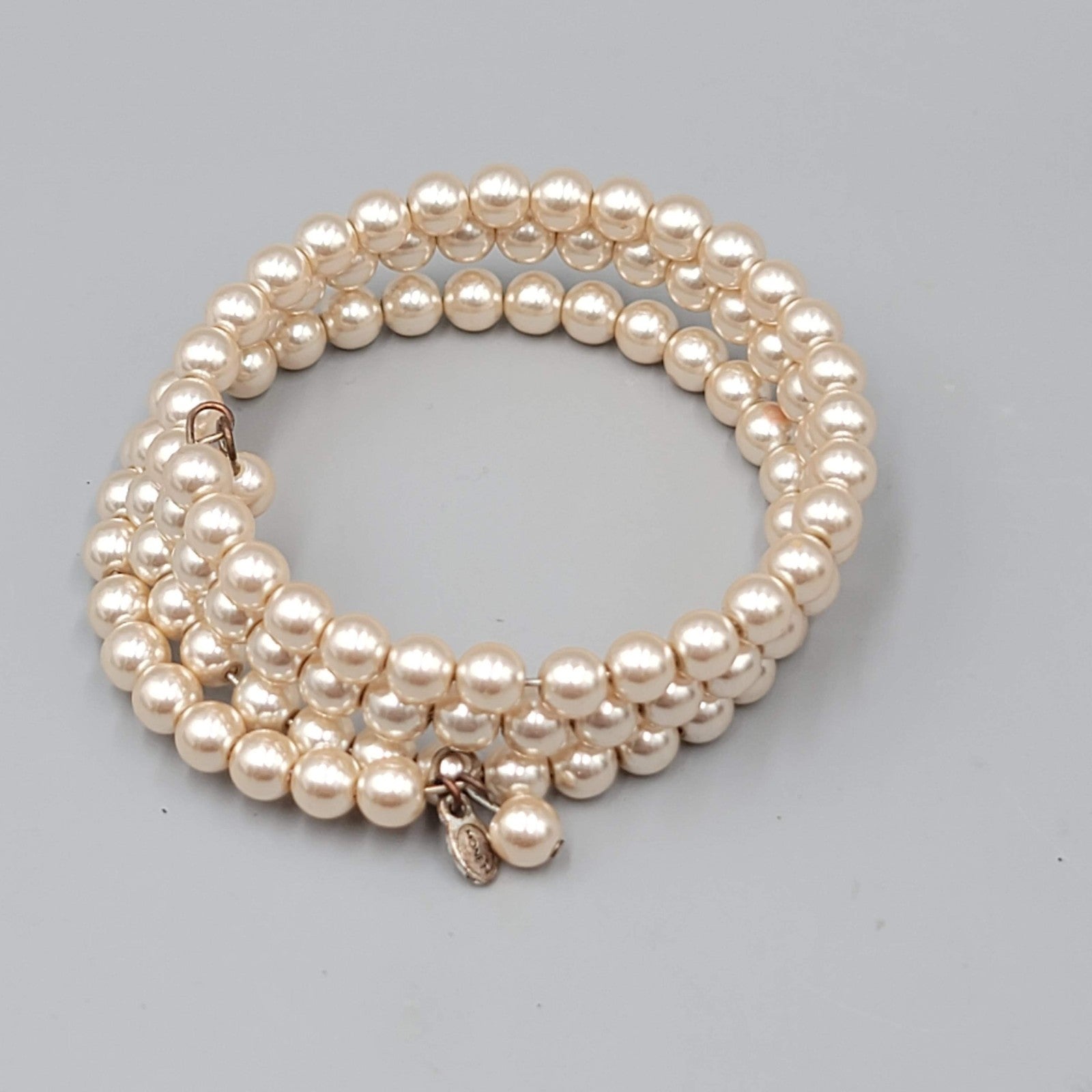 Vintage Monet Faux Pearl Beaded Coil Bracelet Womens Cream Three Row Memory Wire