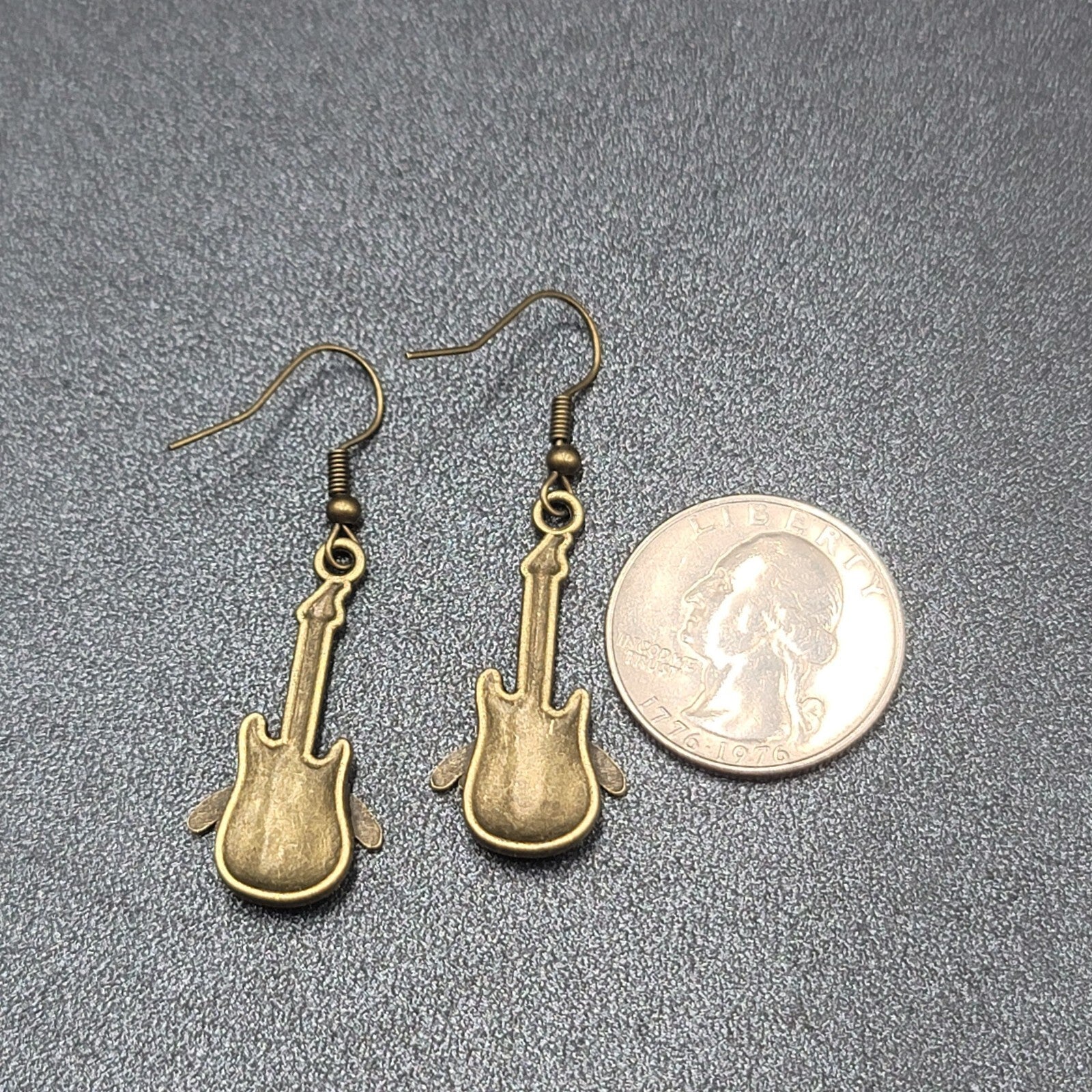 Pierced Earrings Bronze tone Embossed Winged Guitar Dangle 1.25"