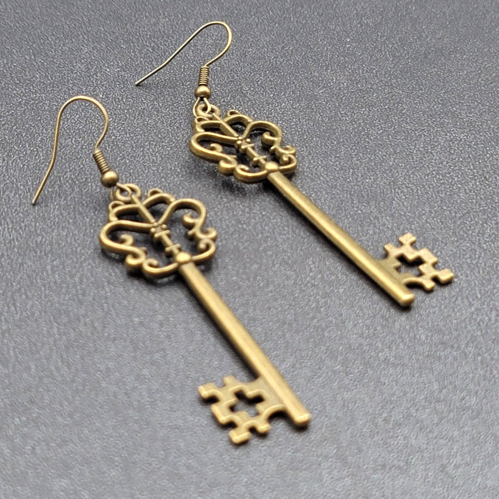 Pierced Earrings Bronze tone Long Antique Skeleton Key Dangle 2.25"