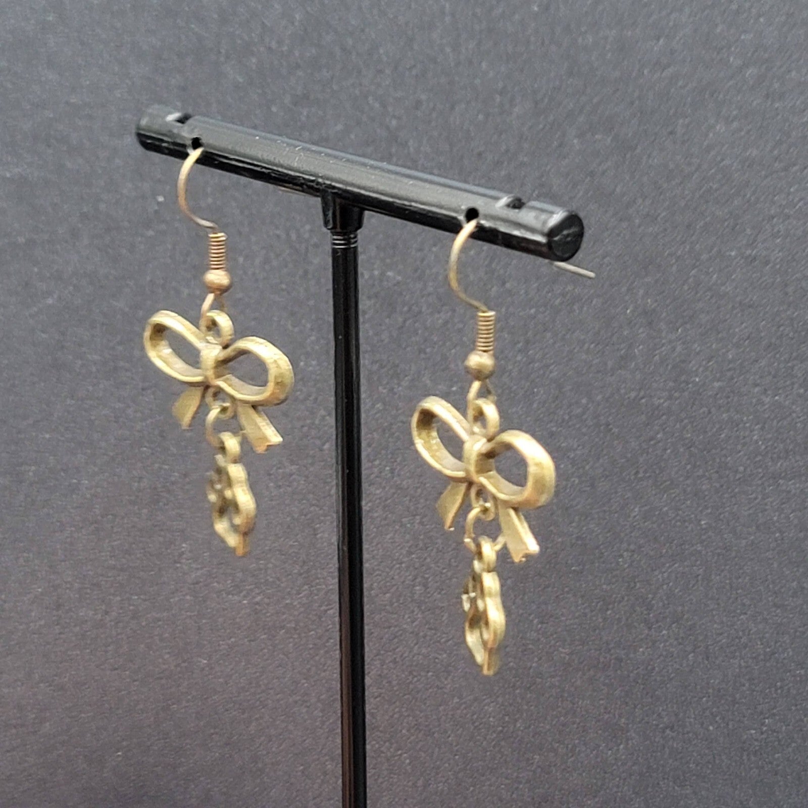 Pierced Bow Dog Paws Earrings Bronze tone Dangle 7/8"