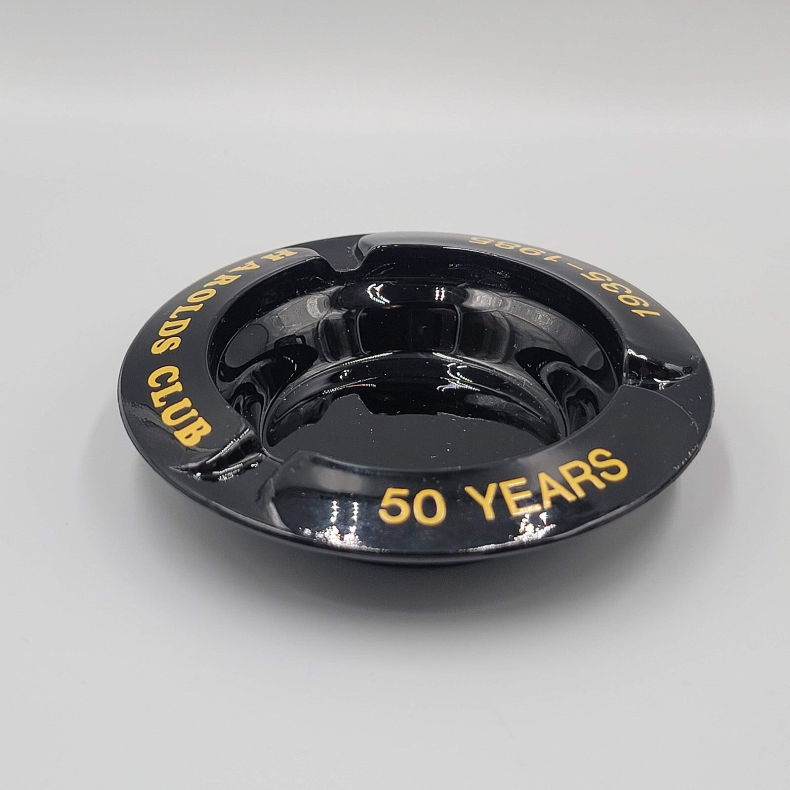 Vintage Ashtray Round Black Gold Print Harolds Club 50 Years 1935-1985 4"