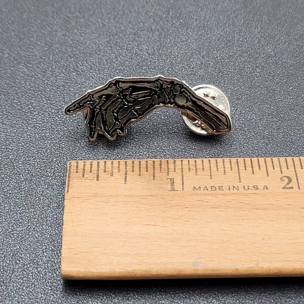 Skeleton Hand Pointing Lapel Pin Black Silver Goth Oddity 1.5"