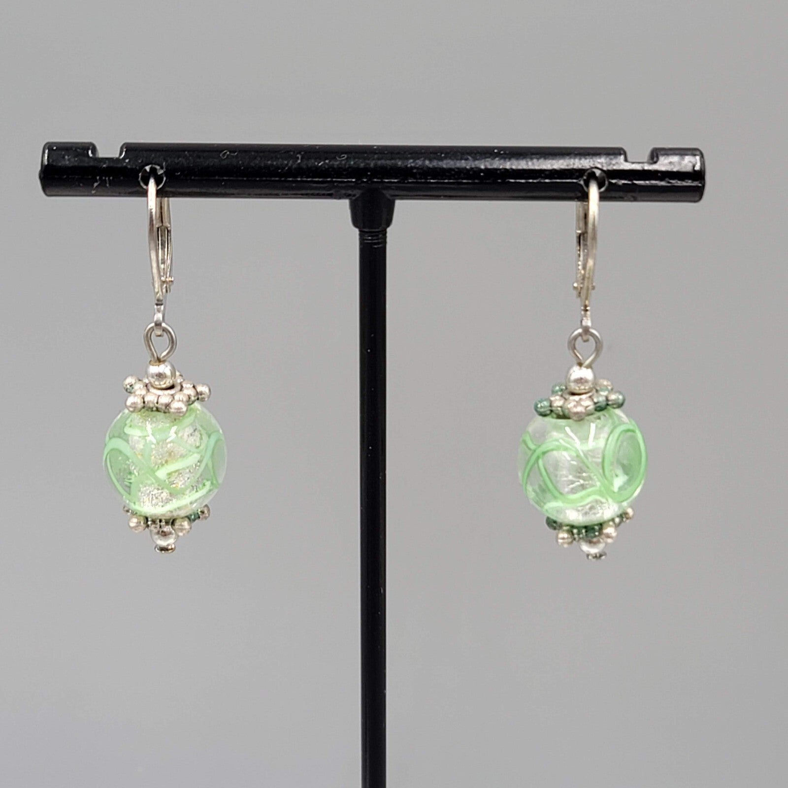 Green Swirl Glass Bead Pierced Earrings Silver tone Dangle 3/4"