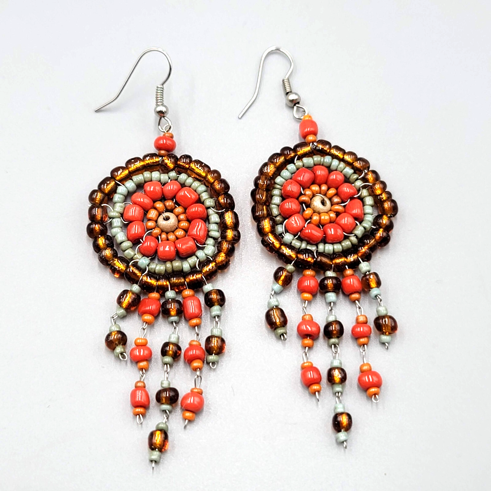 Medallion Bead Pierced Earrings Silver tone Dangle Orange Brown Blue 2.25"