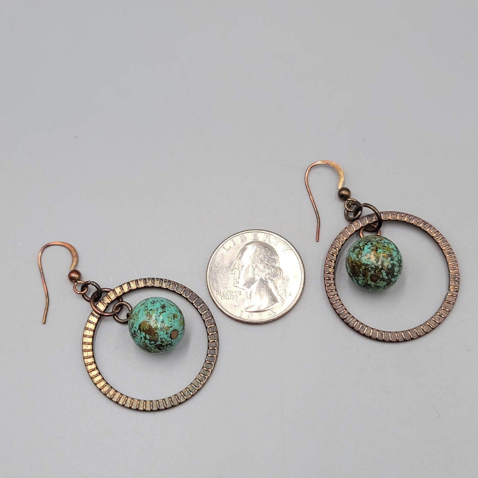 Bronze tone Dangle Pierced Earrings Green Bead Center Dangle 1.5"