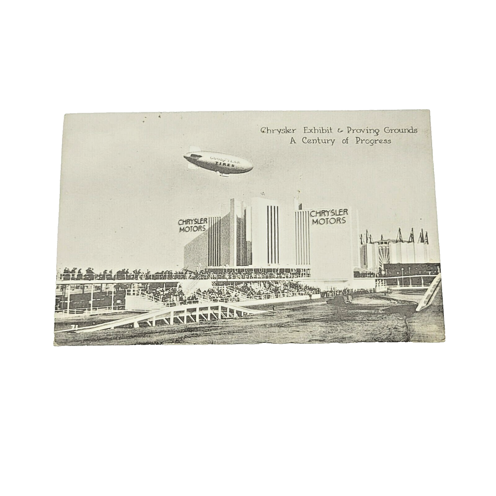 Vintage GOODYEAR BLIMP RELIANCE over Chrysler Motors Chicago ILL Postcard RPPC