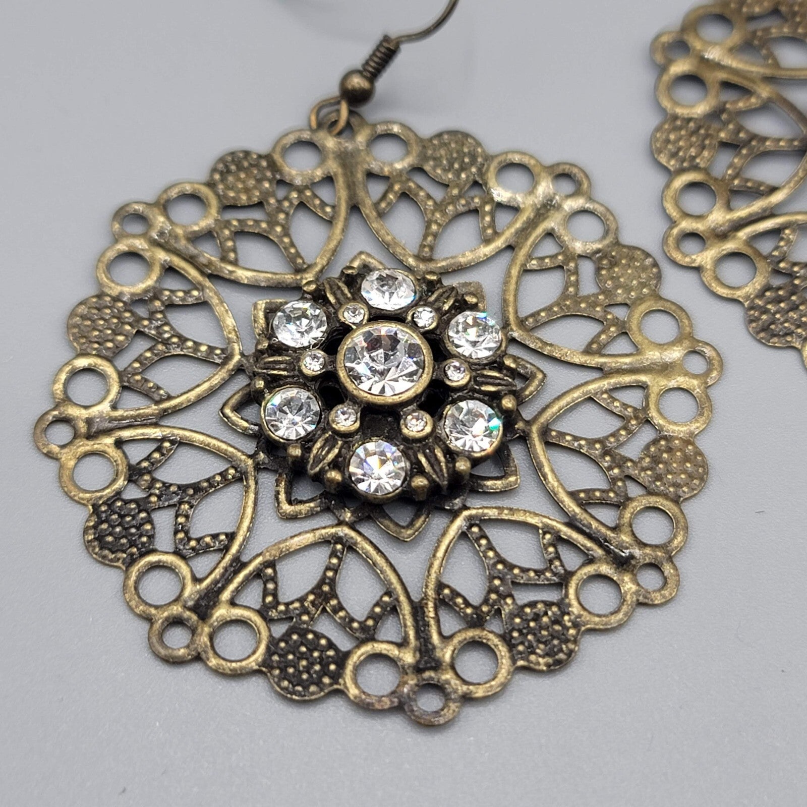 Pierced Earrings Bronze tone Large Metal Filigree Rhinestone Center Boho 1.75"