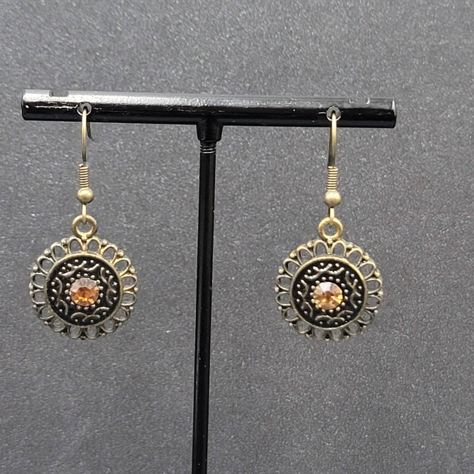 Pierced Earrings Bronze tone Orange Rhinestone Round Filigree 7/8"