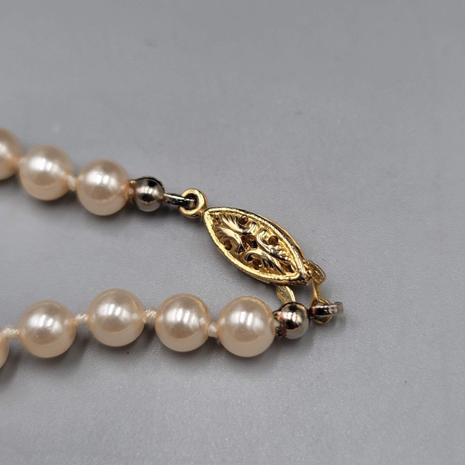 Vintage Faux Pearl Necklace Hand Knotted Gold tone Clasp 24"