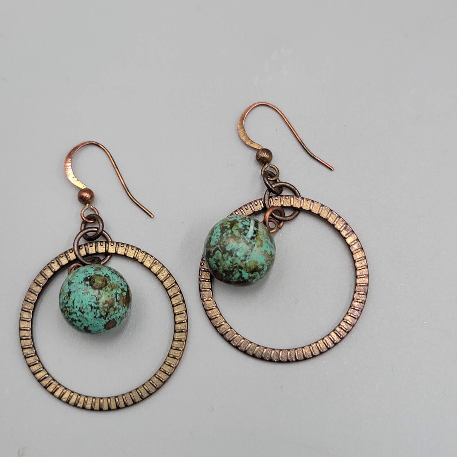 Bronze tone Dangle Pierced Earrings Green Bead Center Dangle 1.5"