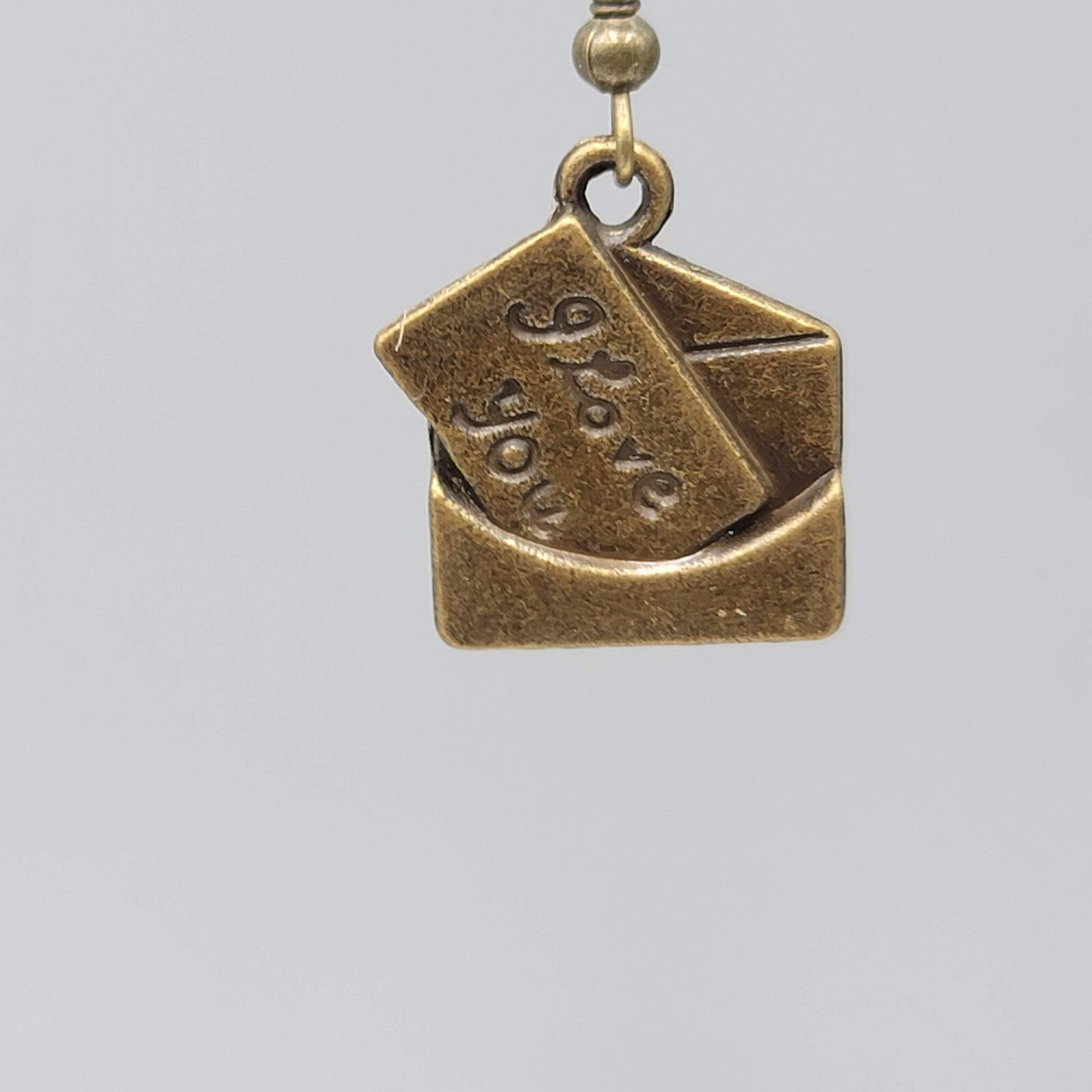 Love Note Pierced Earrings Bronze tone Dangle Embossed 3/4"
