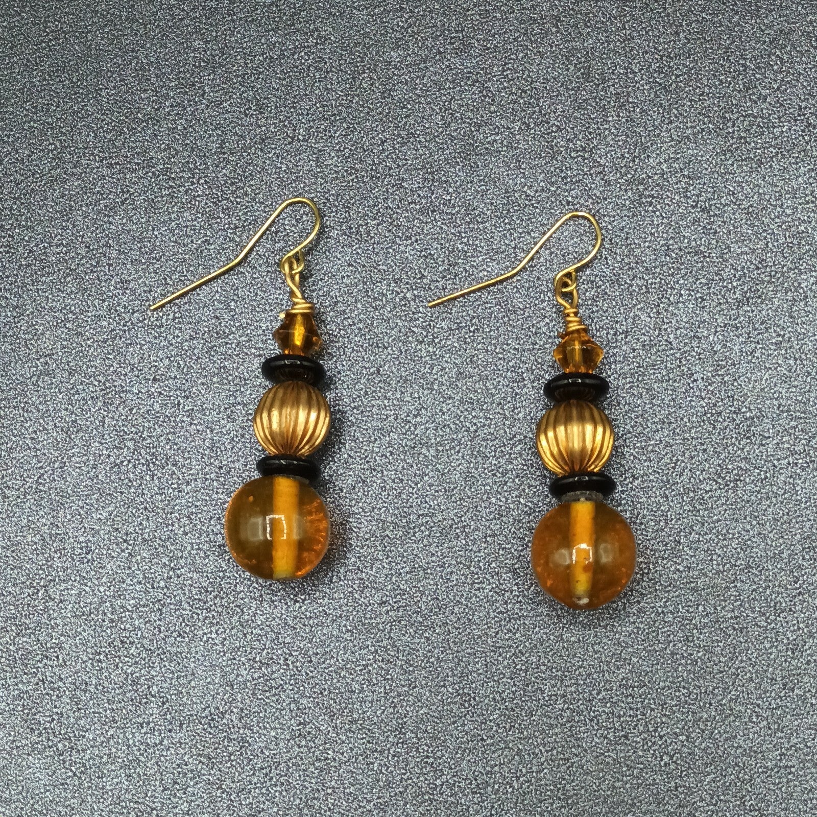 Pierced Earrings Gold tone Orange Black Beaded Statement Dangle 1.5"
