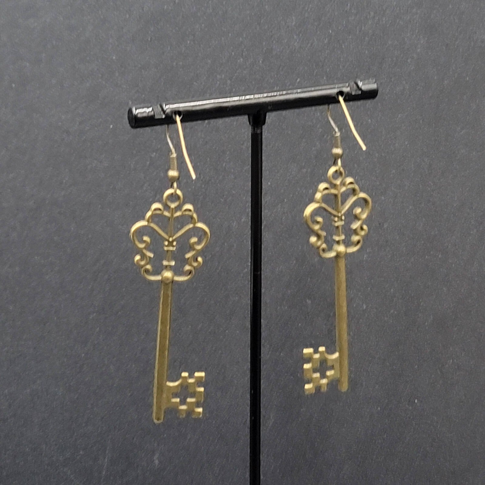 Pierced Earrings Bronze tone Long Antique Skeleton Key Dangle 2.25"